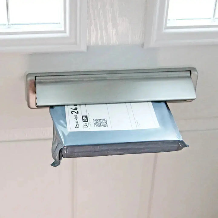 GNAW Chocolate Letterbox in packaging being posted through a door's letterbox